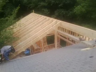 Framing a new roof addition that ties into an existing shingle roof in Somerville
